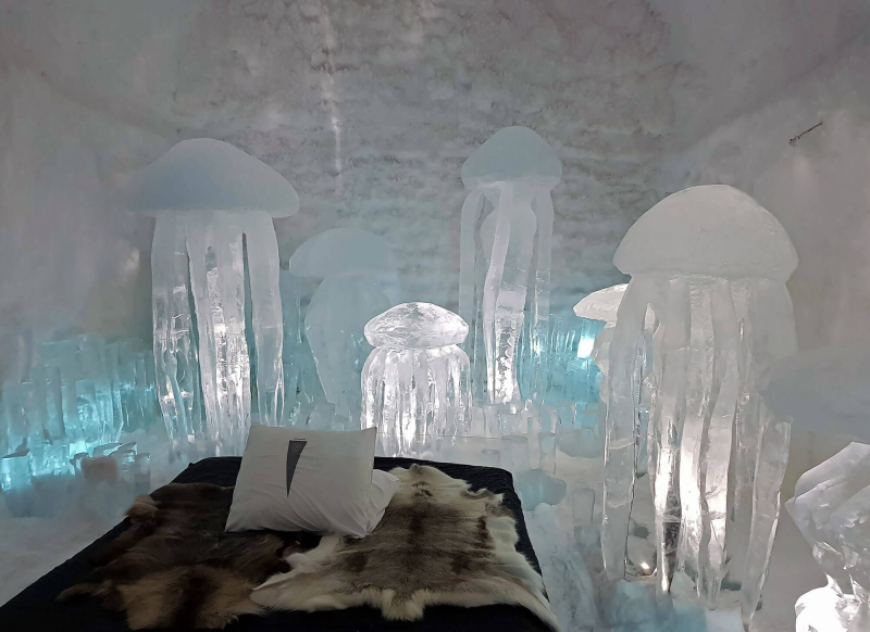 Ice sculpture of jellyfish inside a room in Icehotel