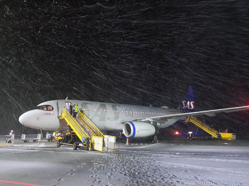 Passenger plane standing on a snowy runway